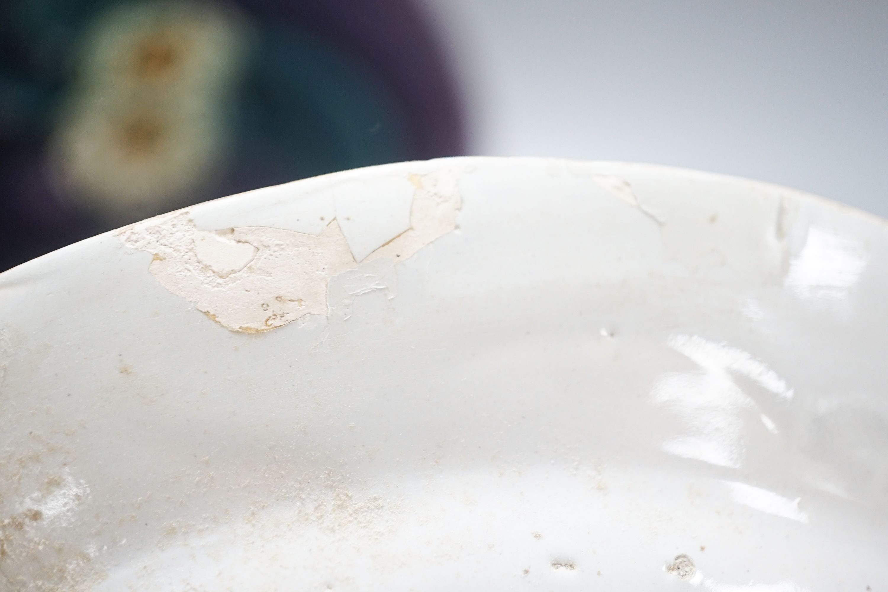 An 18th century delftware polychrome plate and a Mintons secessionist dish (2) 26cm